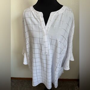 A beautiful white blouse with a silver accent is available in a size 2X.